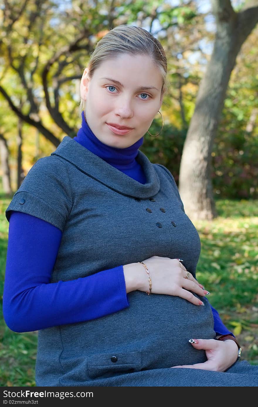 Beautiful pregnant woman in the park. Beautiful pregnant woman in the park