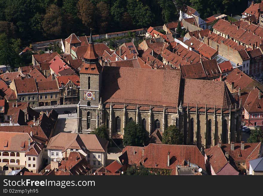 An aerial view of the massive centuries old 'Black Church' in the historic center of Brasov city, Romania. An aerial view of the massive centuries old 'Black Church' in the historic center of Brasov city, Romania.