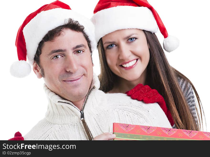 Happy couple holding a Christmas gift. Happy couple holding a Christmas gift