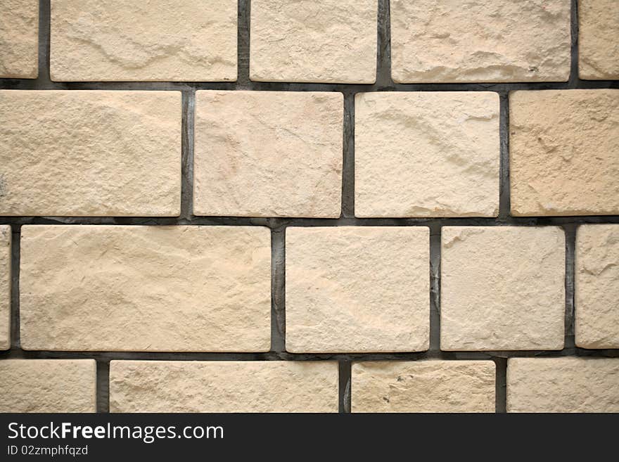 Extreme closeup yellow brick wall background. Extreme closeup yellow brick wall background