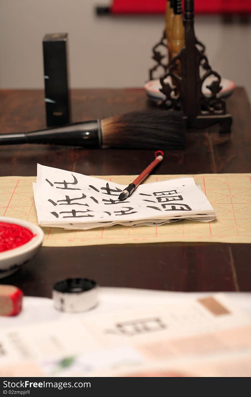 Traditional asian calligraphy set on wooden table. Traditional asian calligraphy set on wooden table