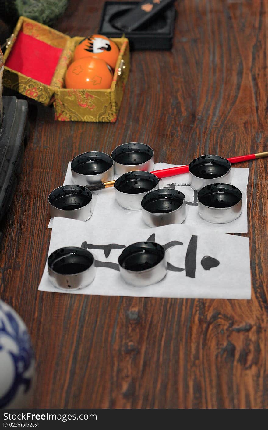 Traditional asian calligraphy set on wooden table. Traditional asian calligraphy set on wooden table