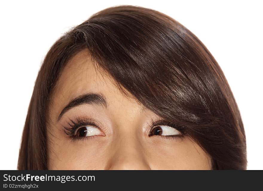 Closeup of young brunette with brown eyes looking to her right, in an expression of thoughtfulness. Closeup of young brunette with brown eyes looking to her right, in an expression of thoughtfulness.