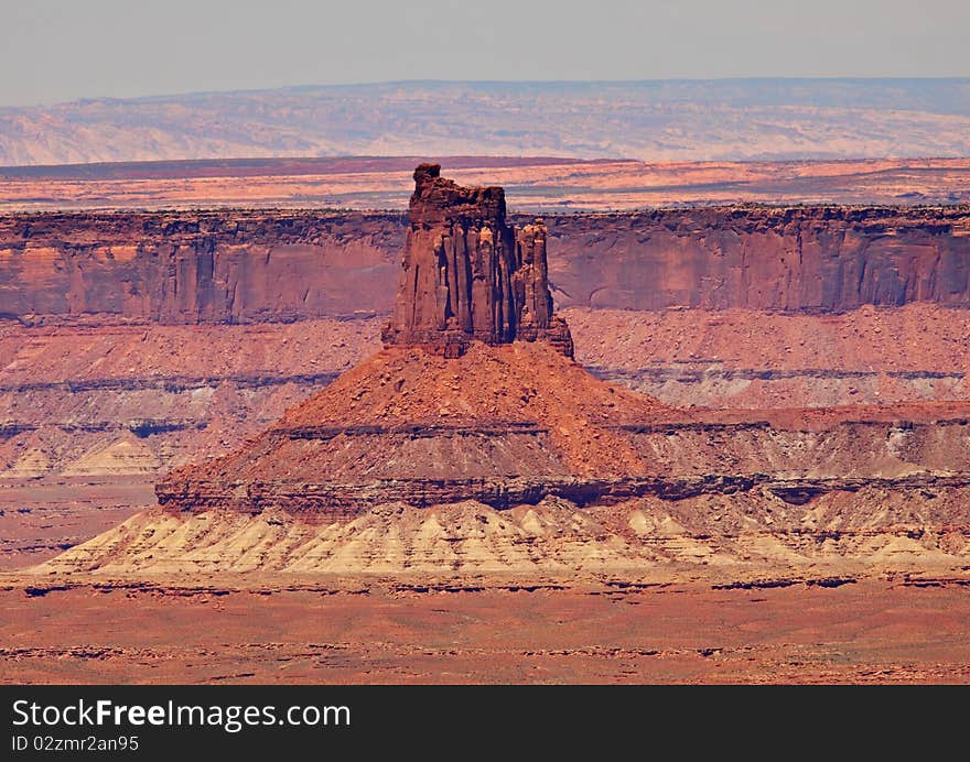 Looking out over Canyonlands National park in Utah, USA with massive rock formation in the valley floor