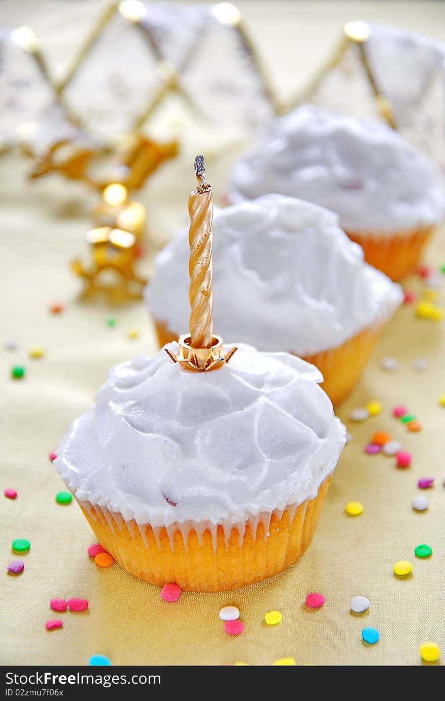 Milk white muffins with candle