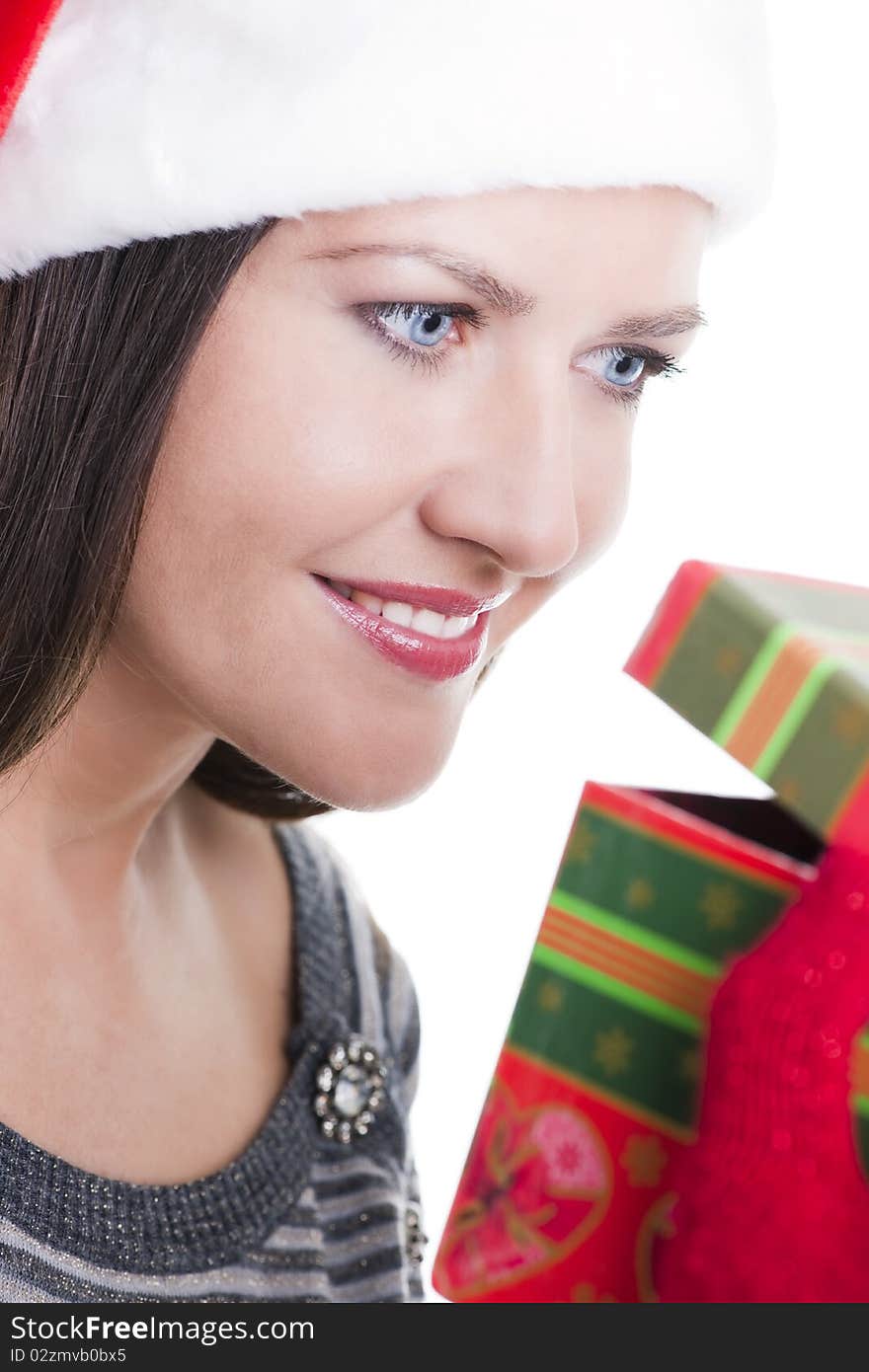 Happy young woman opening a Christmas present. Happy young woman opening a Christmas present