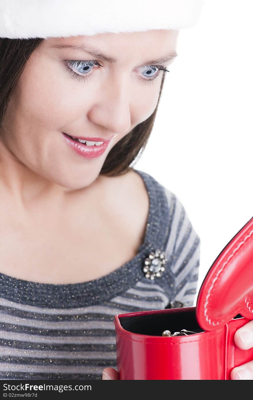 Surprised young woman opening a Christmas present. Surprised young woman opening a Christmas present