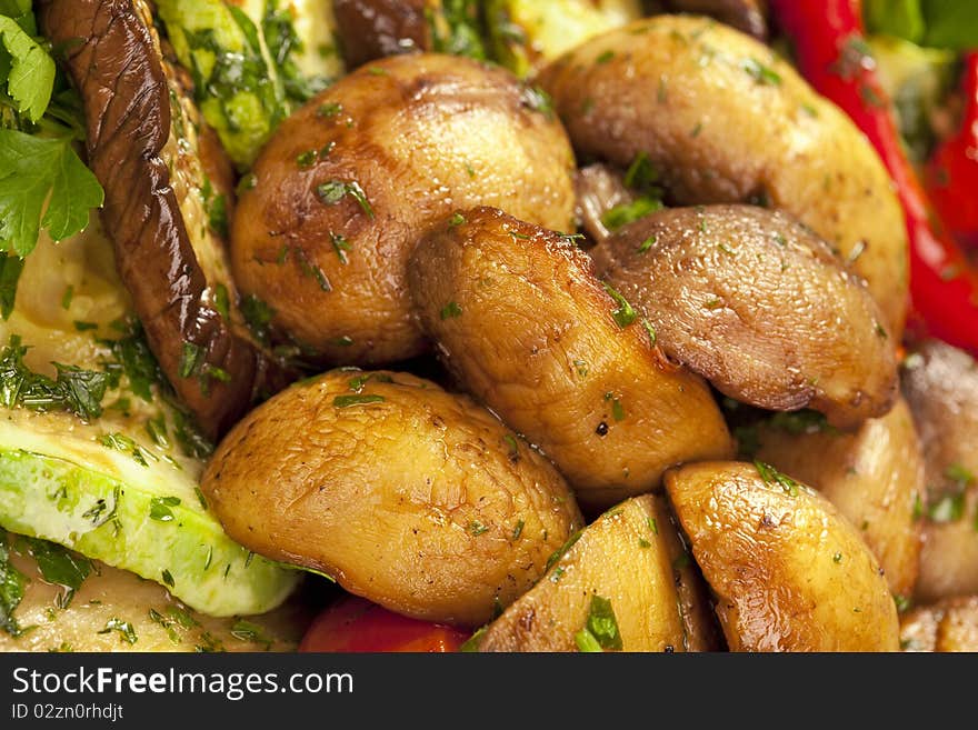 Baked potato, zucchini, eggplant on plate. Vegetarian food