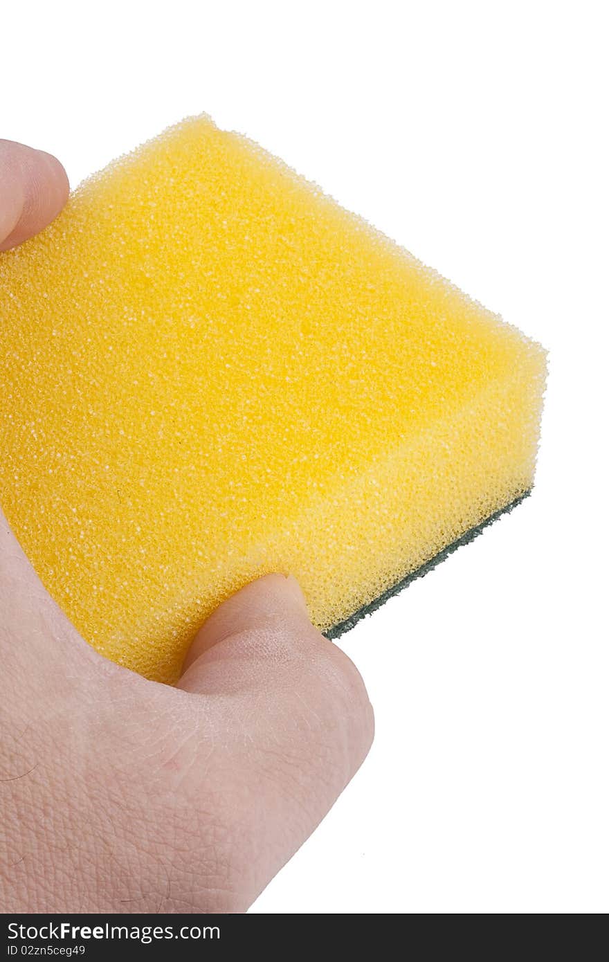 Yellow synthetic sponge for cleaning the men's hand.