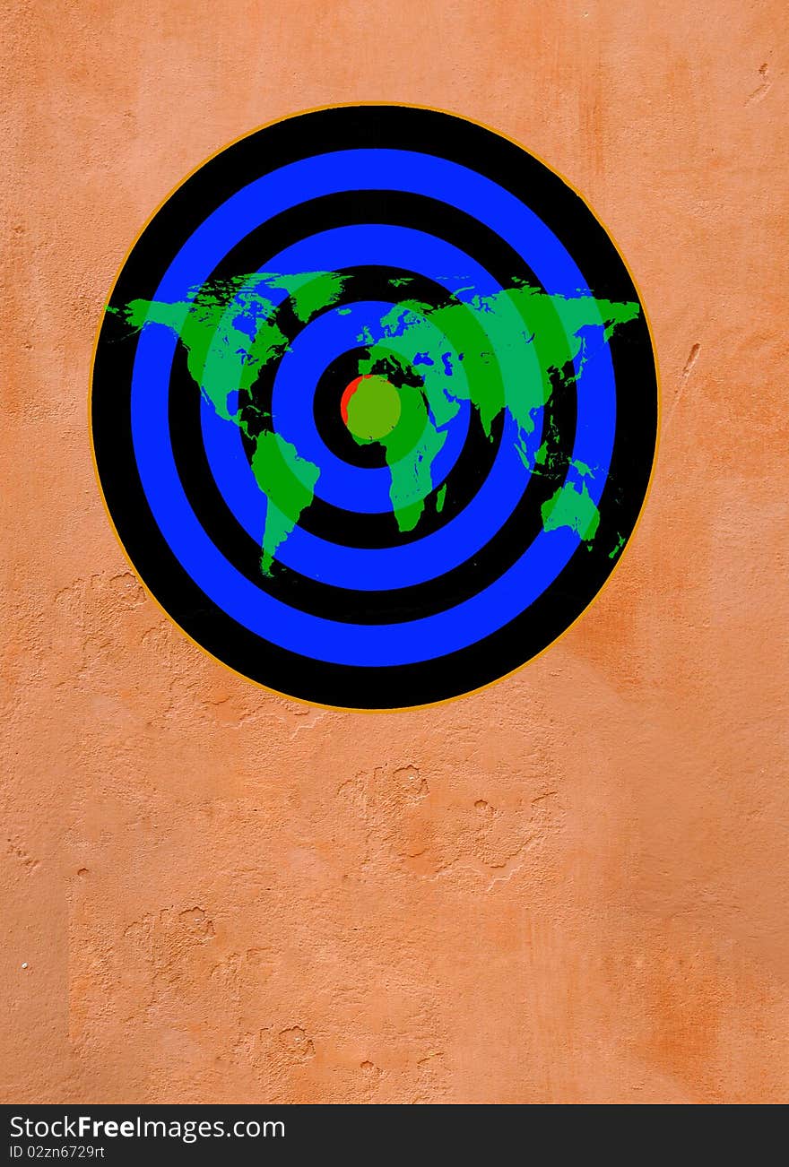 Map of world over dartboard target on brown wall. Map of world over dartboard target on brown wall