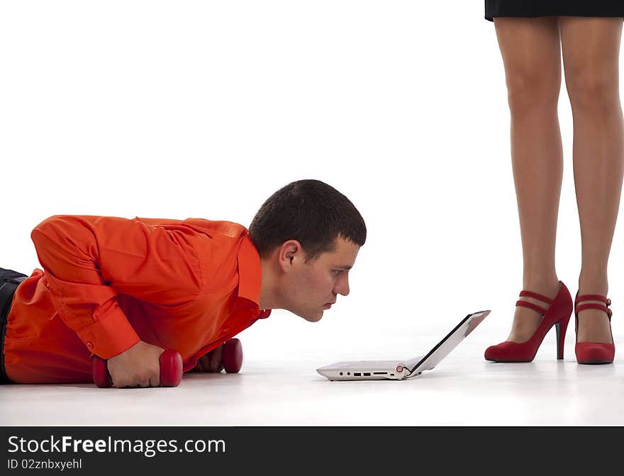 Businessman doing push-ups with dumbbells