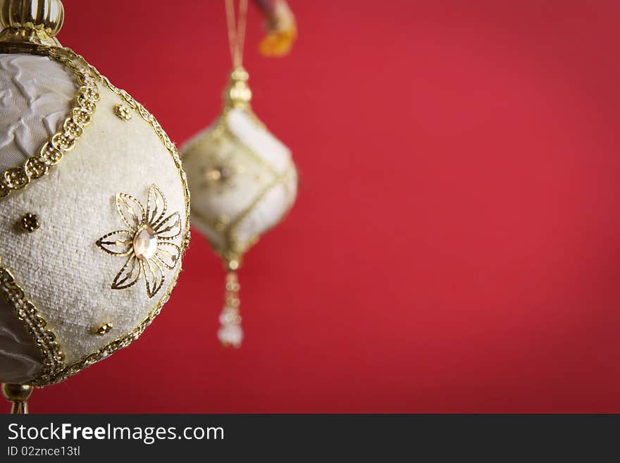 Gold and white christmas balls on red background,. Gold and white christmas balls on red background,