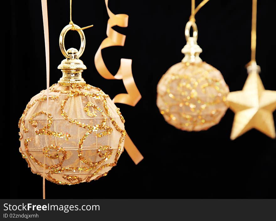 Christmas card with decorated ball and ribbon over black background