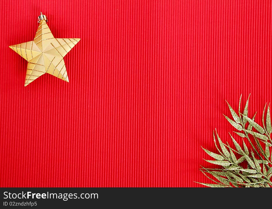 Gold Christmas star and green ribbon  over red background. Gold Christmas star and green ribbon  over red background