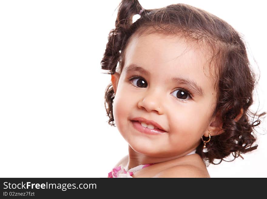 Beauty little girl looking at the camera and smiling