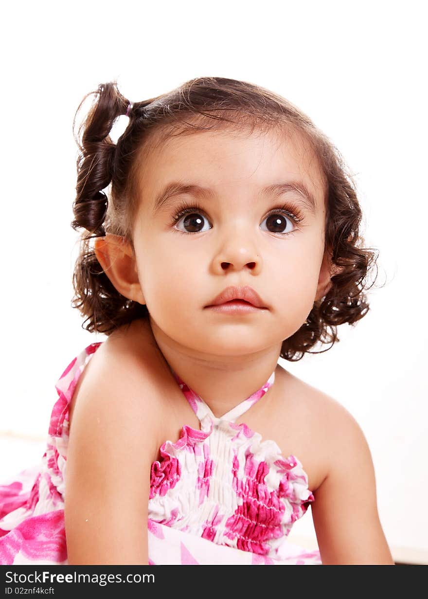 Little girl looking up on white background