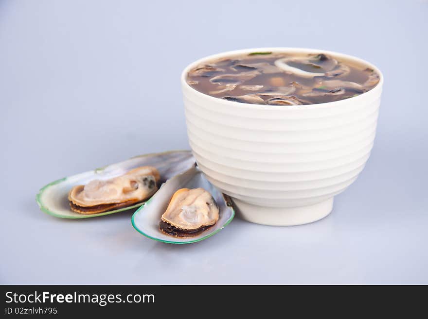 A traditional Japanese soup made from the brine in a white plate