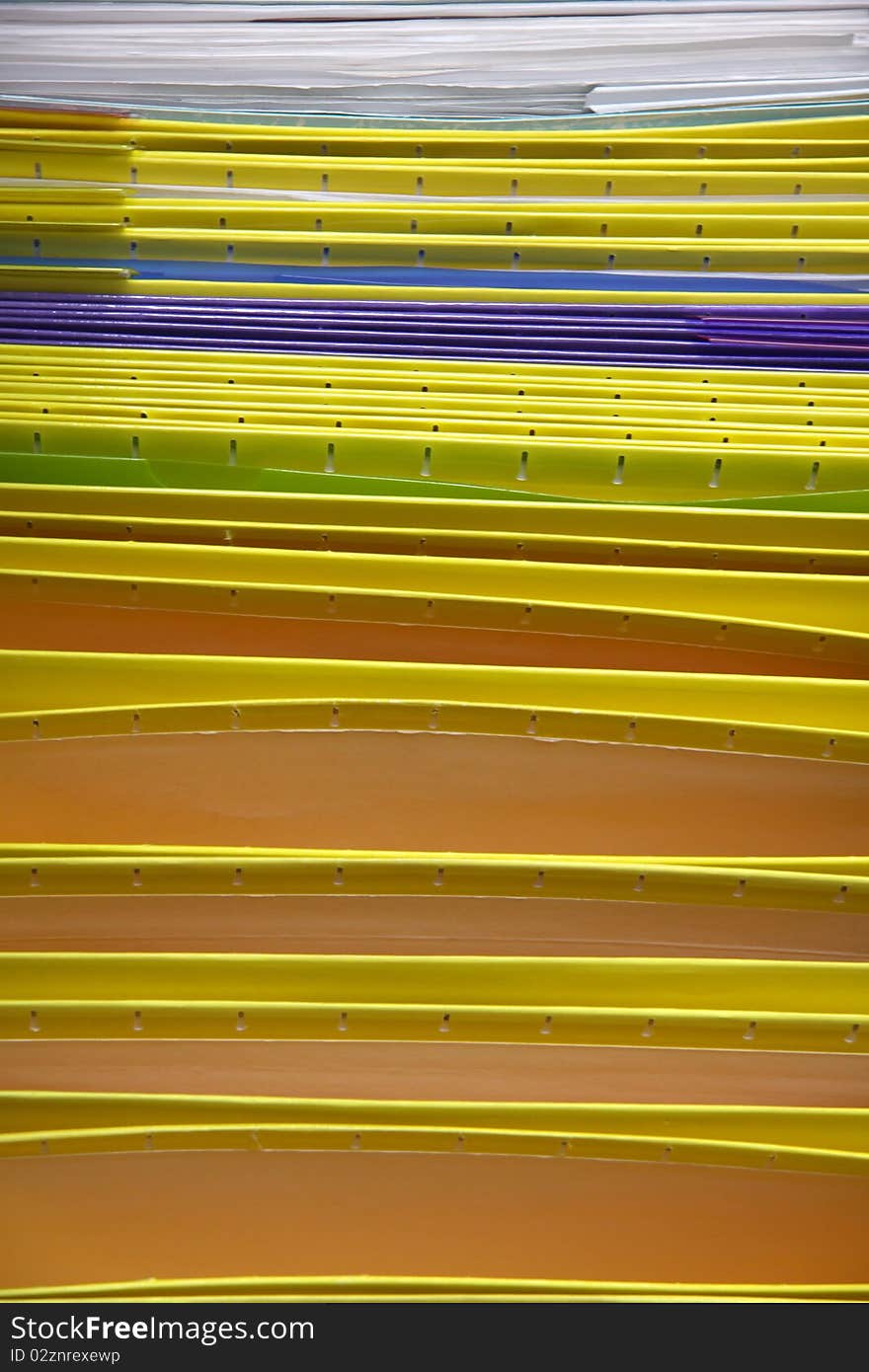 Lot of colorful folders arranged in a row