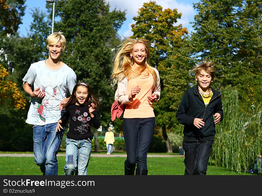 Happy family have fun and stroll in park. Happy family have fun and stroll in park