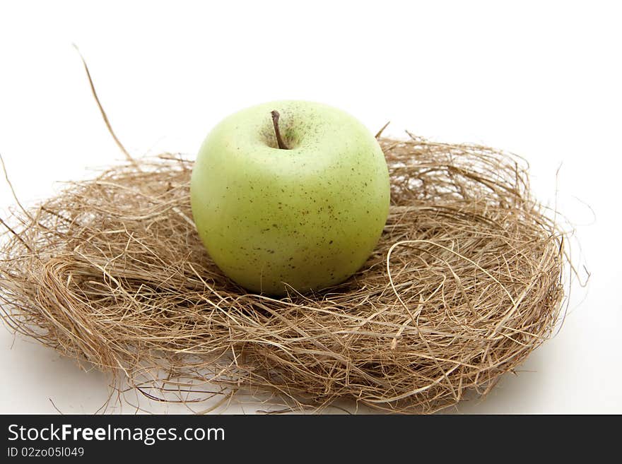 Green apple with hay