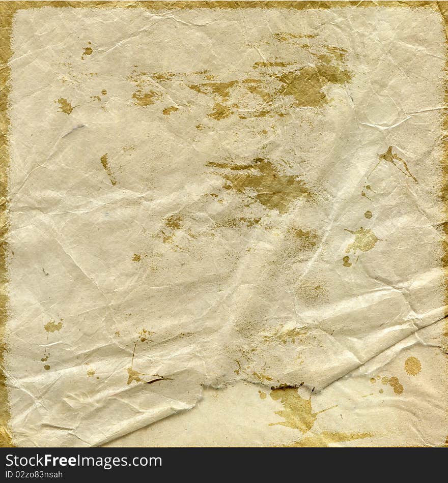 Wrinkled gold splatter stained paper