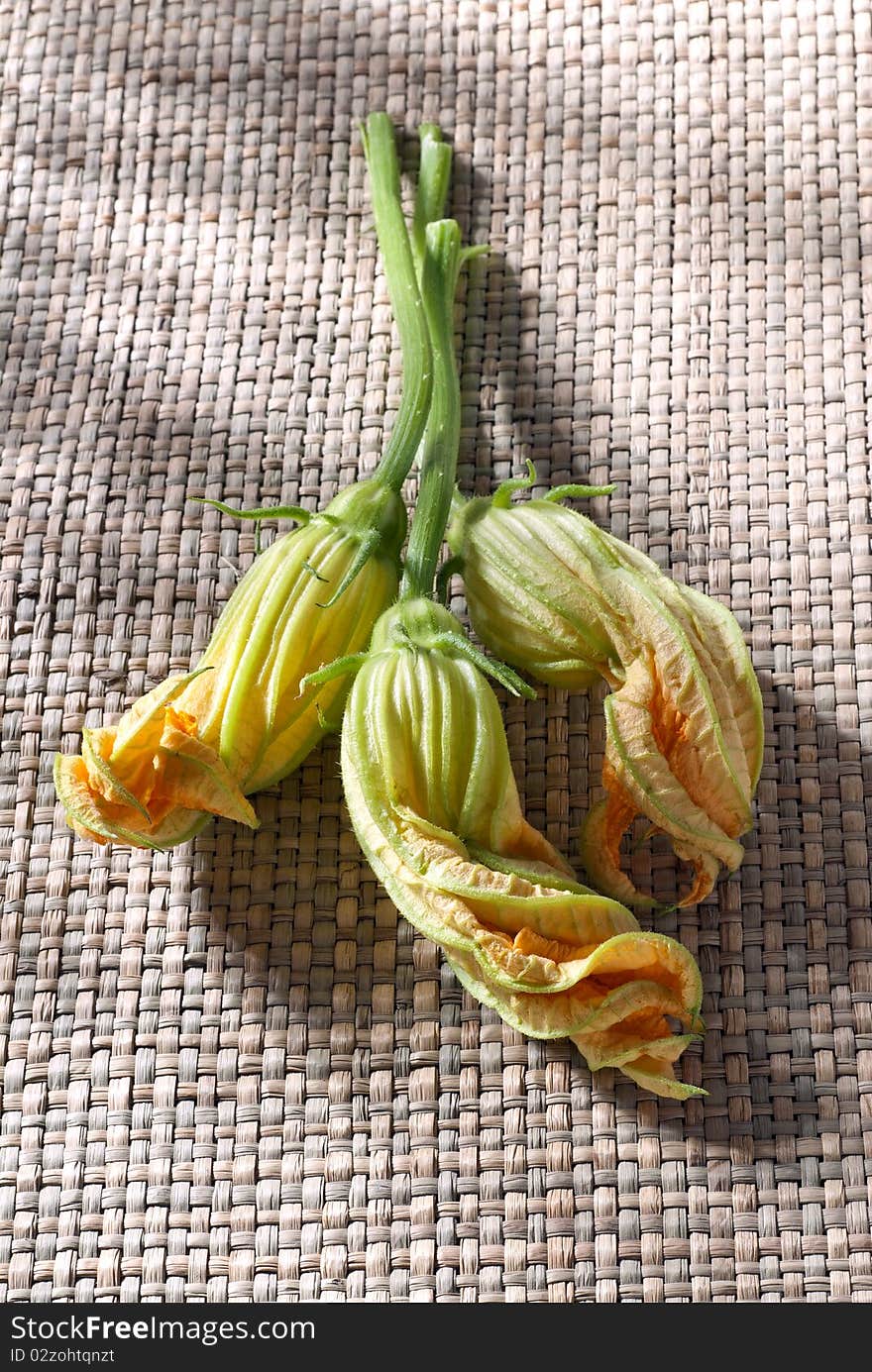 Zucchini flowers on a mat