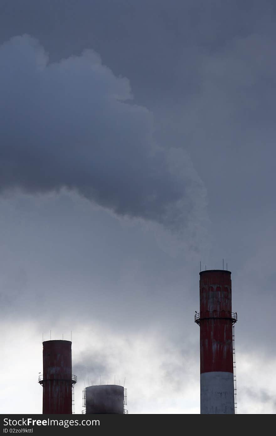 Emissions from pipes of a thermal power station. Emissions from pipes of a thermal power station