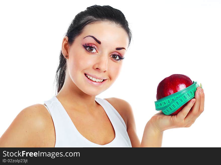 Beautiful young brunette with a big red apple and tape. Beautiful young brunette with a big red apple and tape