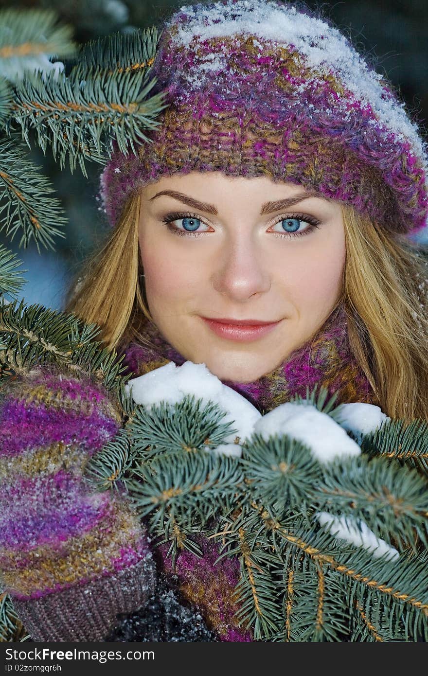 Portrait of beautiful adult girl outdoor in winter