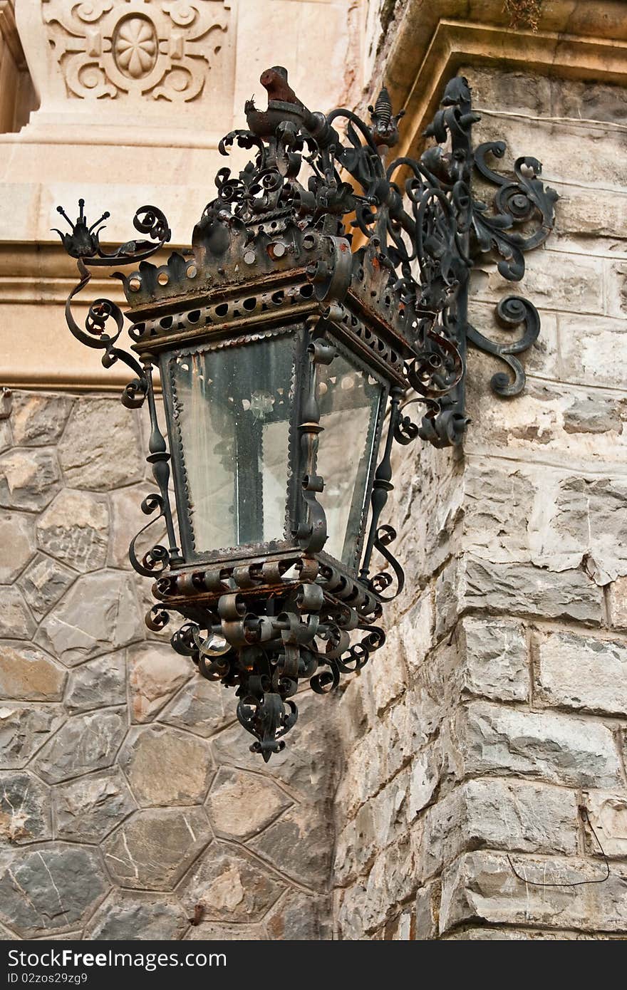 Ancient street lamp on medieval house