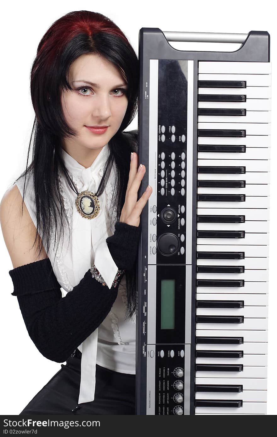 Beautiful girl with synthesizer isolated