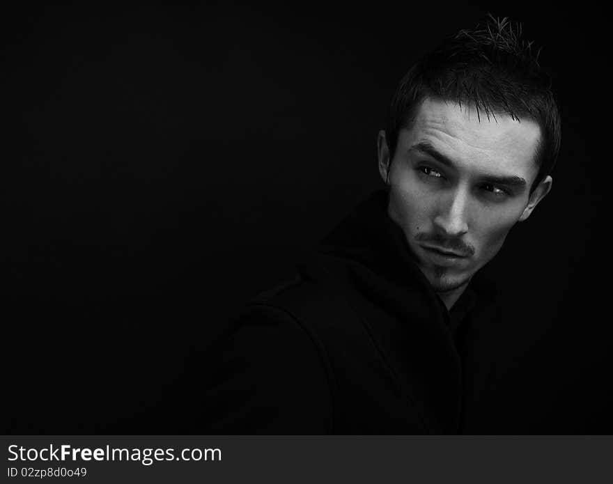 Attractive young man wearing elegant black suit