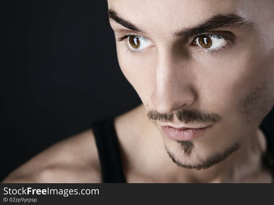 Young man's portrait. Close-up face.