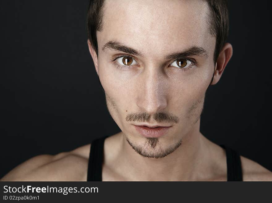 Young man's portrait. Close-up face.