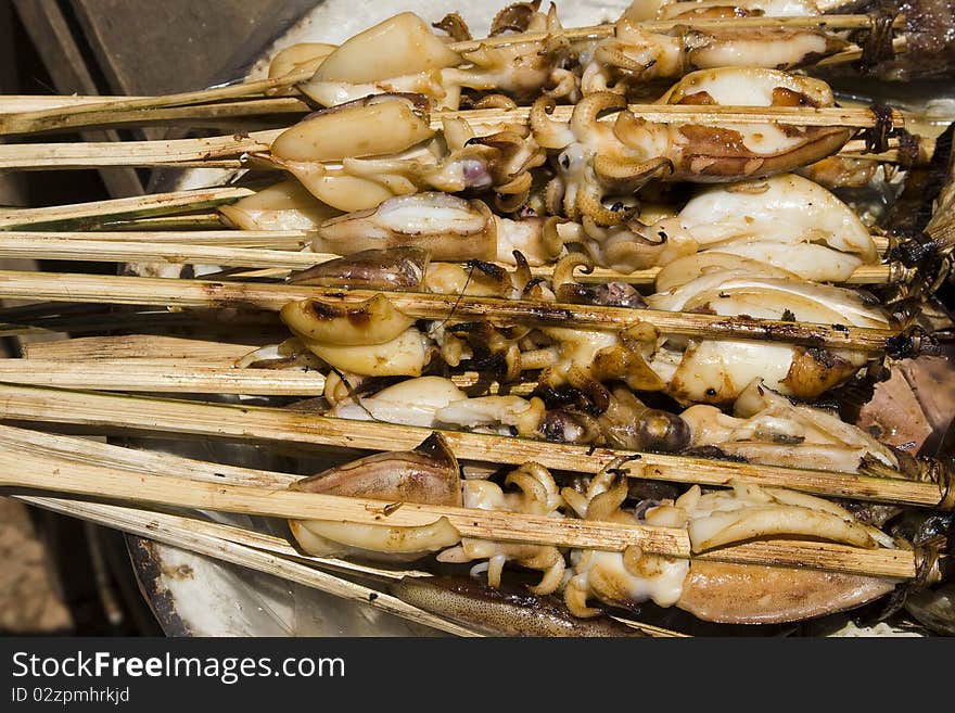 Grilled calamari at a market in Asia