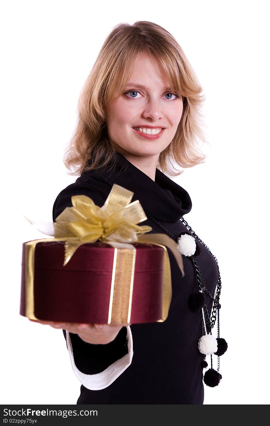 Beautiful smiling woman with a gift. Attractive girl holding purple box with gold ribbon. Isolated over white background. Beautiful smiling woman with a gift. Attractive girl holding purple box with gold ribbon. Isolated over white background