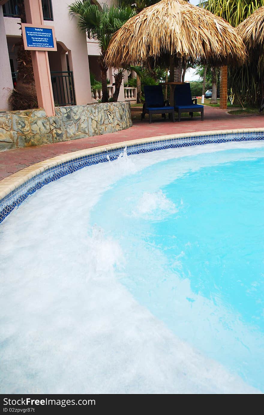 Luxury Resort Pool and hotel garden in Aruba.