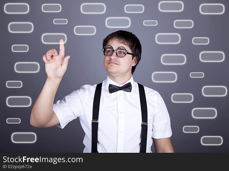 Portrait of funny fashion men in suspender with bow tie and glasses show visual plate. Studio shot. Portrait of funny fashion men in suspender with bow tie and glasses show visual plate. Studio shot.