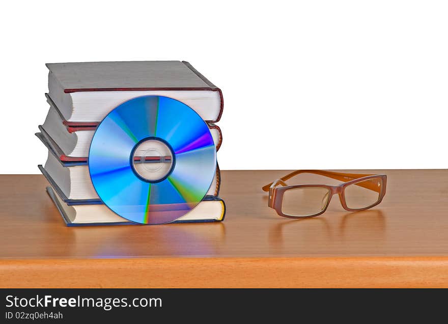 Books, eyeglasses, and DVD