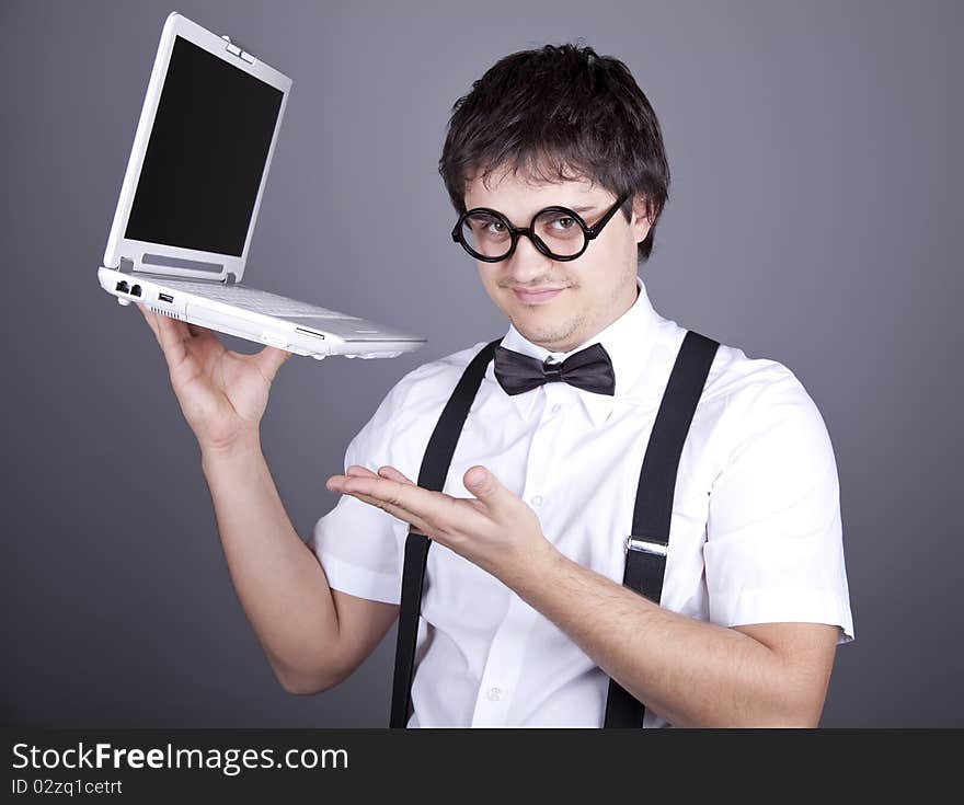 Men in suspender with notebook.