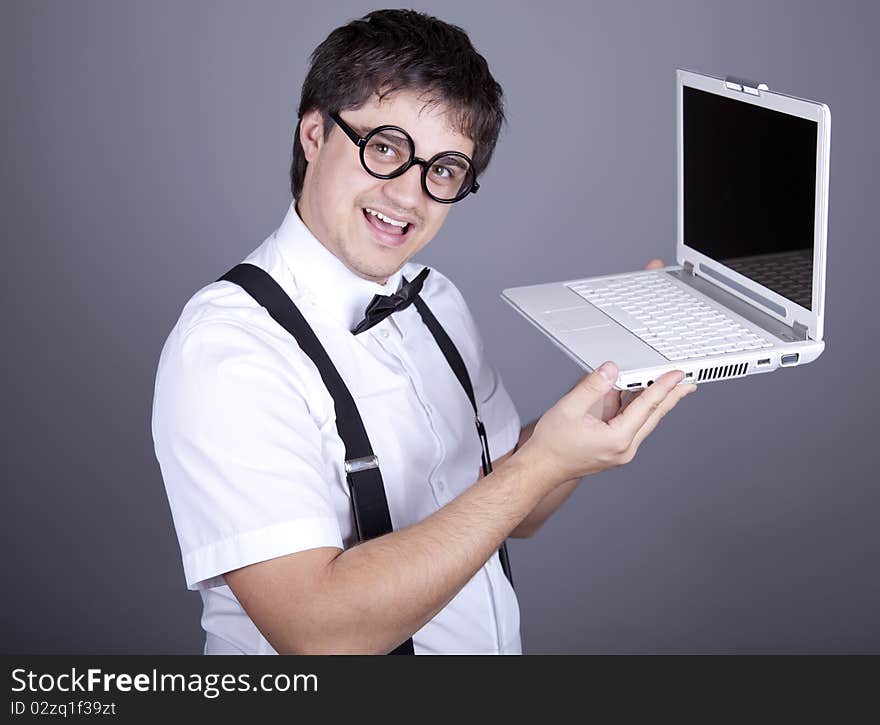 Men in suspender with notebook.