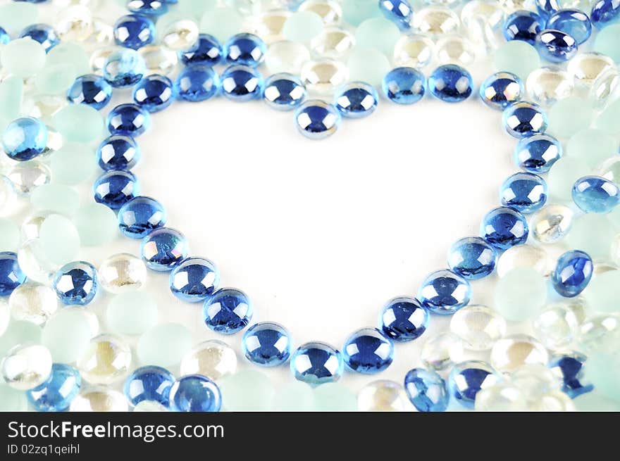 Heart frame from shiny glass marbles