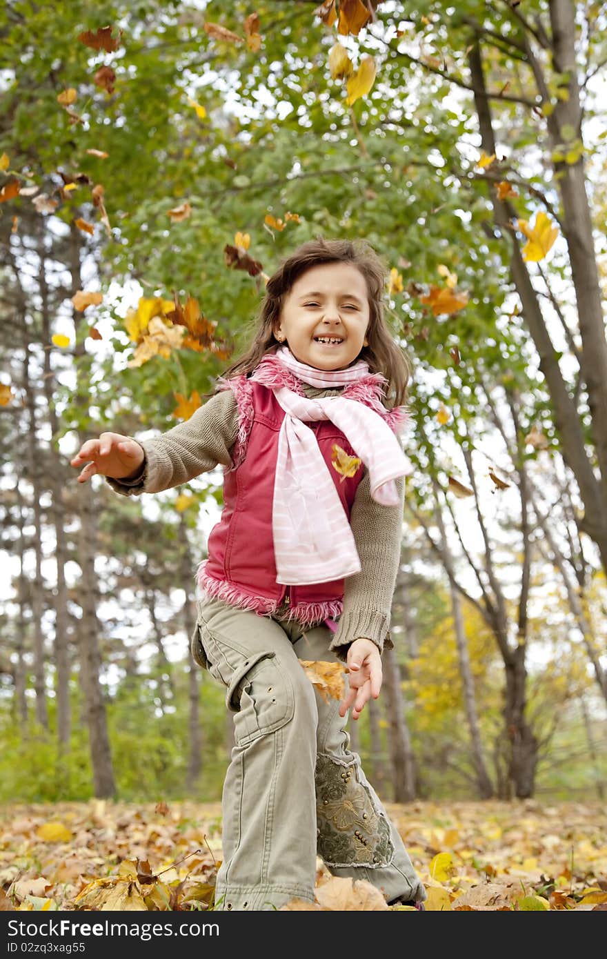 Cute girl in autumn park.