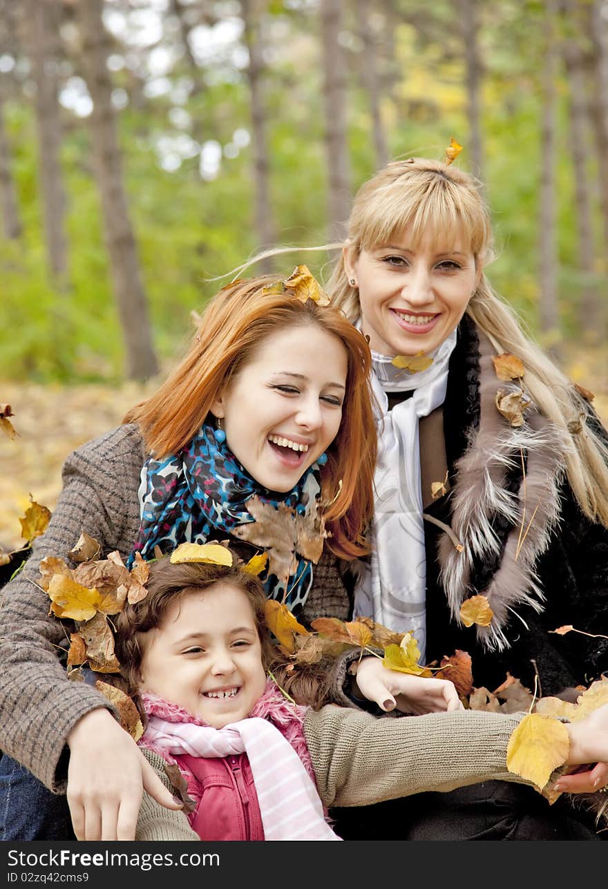 Two sisters and mother in the park.