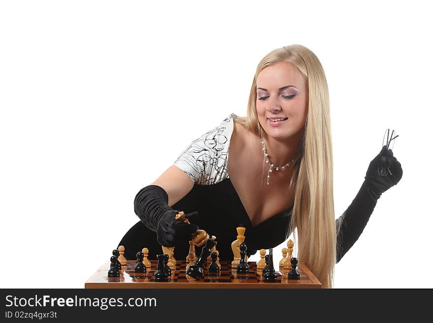 Young glamour blond woman end the chess game by a checkmate