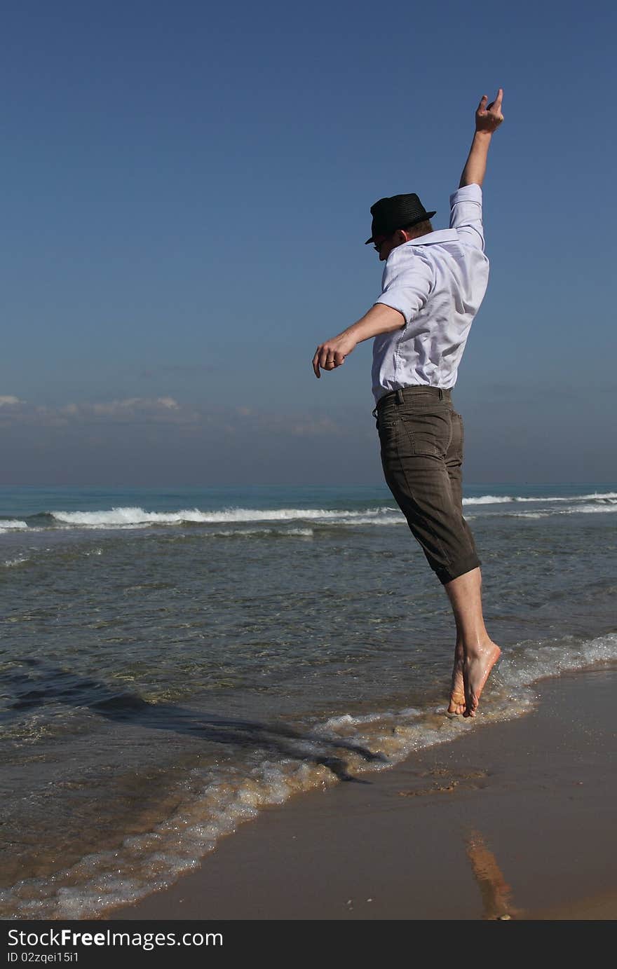 Handsome 30-year-old man celebrates success at sea