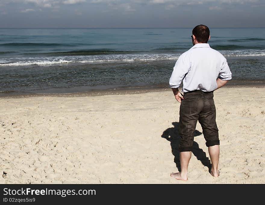 Man enjoying a beautiful seascape. Man enjoying a beautiful seascape