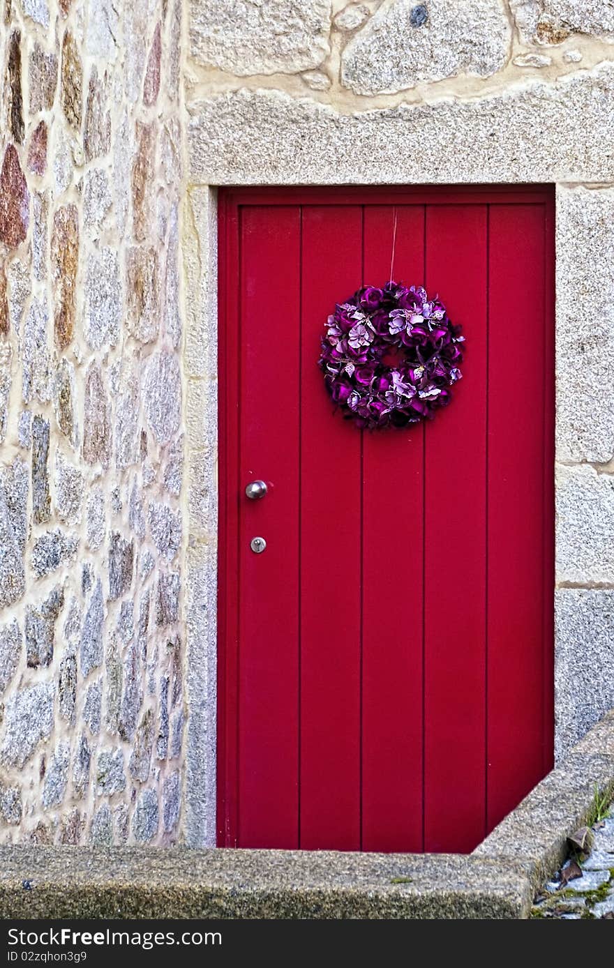 Christmas ornament applied to a red door