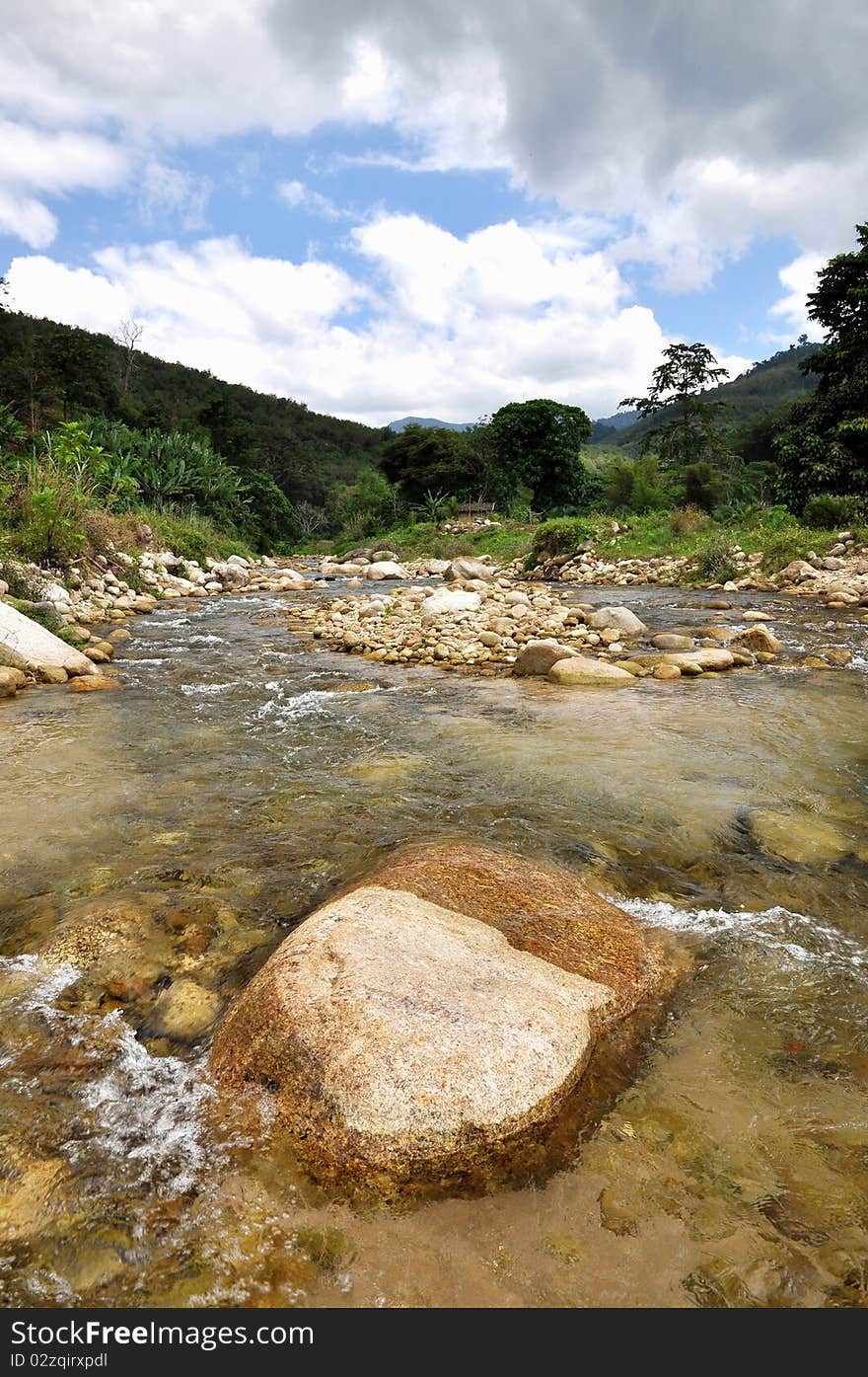 A small stream in the mountains. This area used to flood a long time ago. A small stream in the mountains. This area used to flood a long time ago.