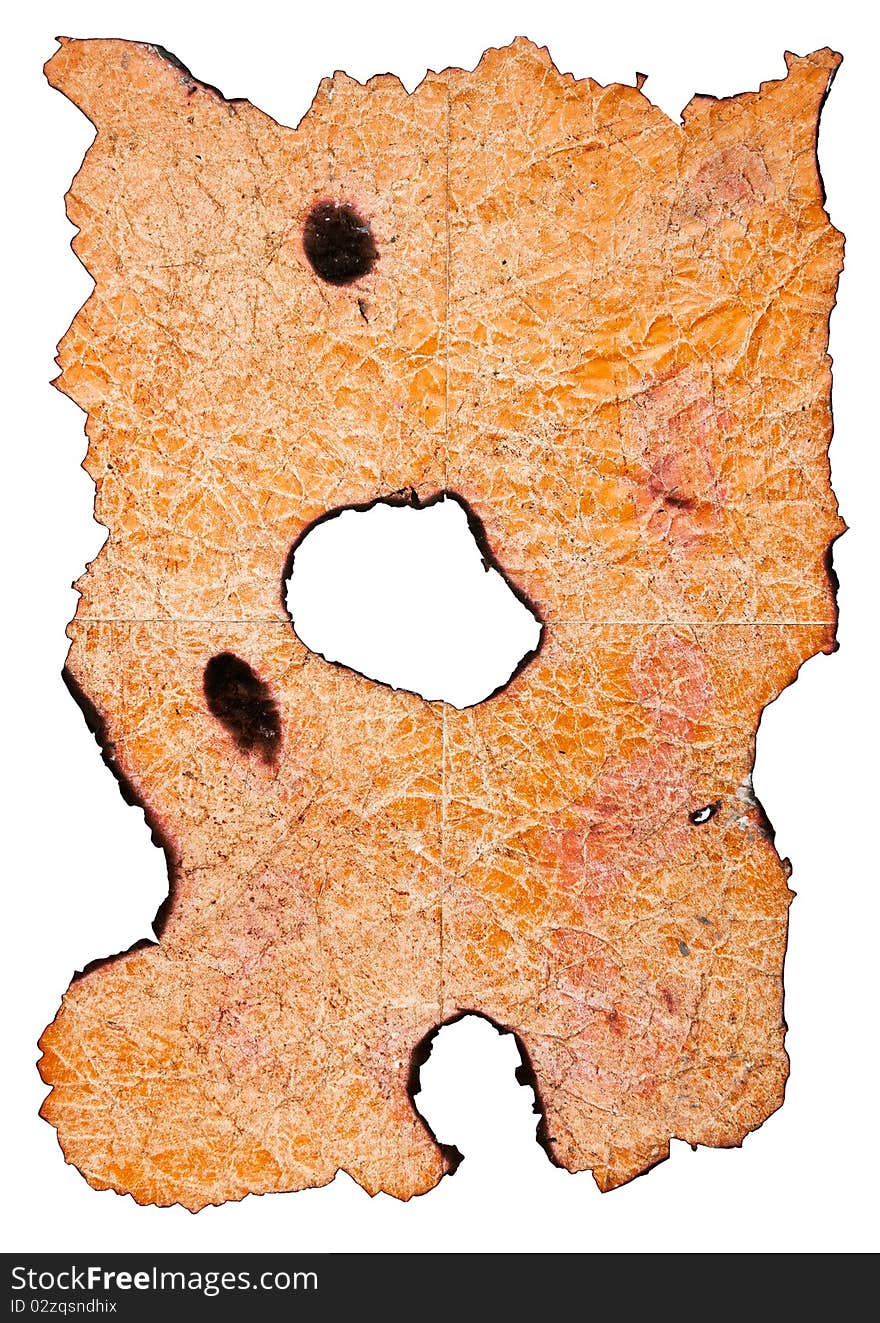 Orange burnt paper sheet with hole